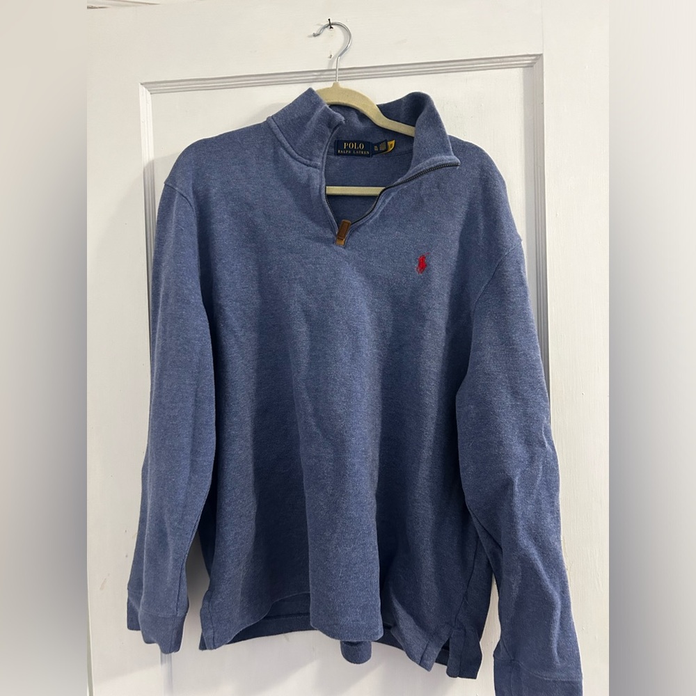 Very good almost new like condition polo Ralph Lauren blue with red emblem.